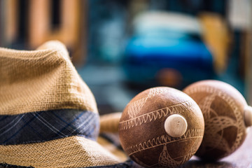 Travel to Cuba related items, hat and maracas