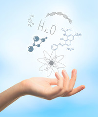 Scientist  hand with chemical formulas. Concept of future technology