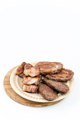 Served grilled meat on the plate over white background