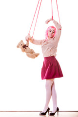 woman girl stylized like marionette puppet on string