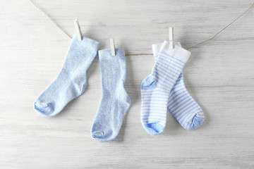 Baby socks on wooden background