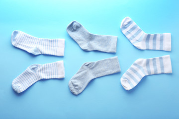 Baby socks on blue background