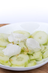 Sliced cucumbers in onions and cream