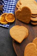 Heart shaped biscuits on cutting board, closeup