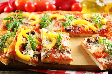 Pieces of delicious pizza on the table, close-up