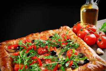 Freshly homemade pizza on black background