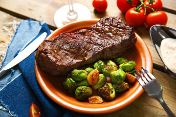 Grilled steak with vegetables, closeup
