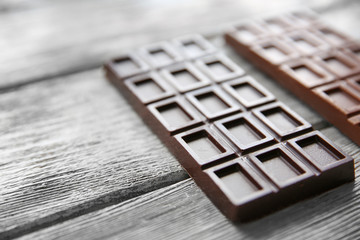 Chocolate bars  on wooden background
