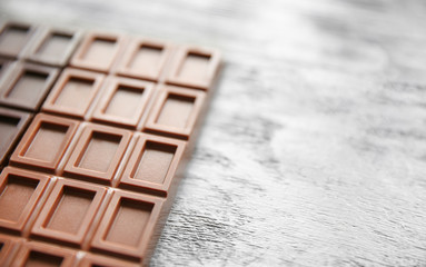 Chocolate bars  on wooden background