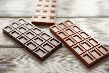 Chocolate bars  on wooden background