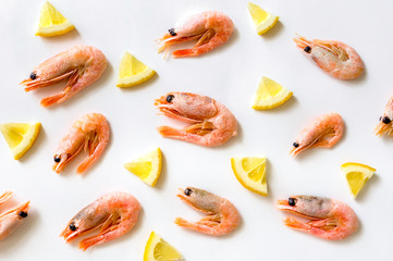 Boiled prawns with sliced lemon. Food pattern. 