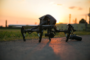Professional drone is ready to fly at sunset