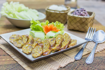 Asgaew Hors d'oeuvres food Northern style tradition Thai cuisine menu what we call "Sai Oua" in Thai with herbs fried sausage sour pork, chili youth delicious food in Chiangmai province Thailand.
