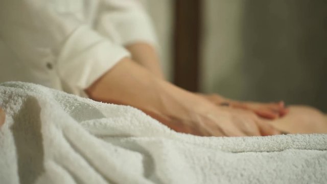 pregnant woman doing foot massage