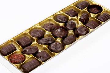A Box of Dark Chocolates on White Background