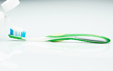 put tooth paste on brush