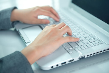 business woman hand typing on laptop keyboard