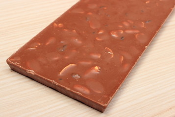 Whole nutritious chocolate with nuts and raisins