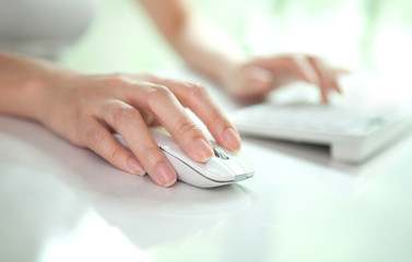 Fototapeta premium business woman hand typing on laptop keyboard and click mouse