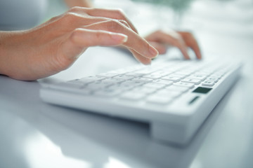 business woman hand typing on laptop keyboard