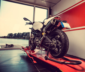 New sport motorcycle in a garage.