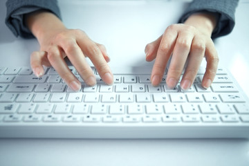 Fototapeta na wymiar business woman hand typing on laptop keyboard