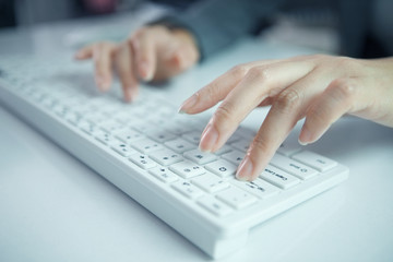 business woman hand typing on laptop keyboard