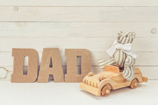 Fathers Day Background With Teddy Bear By Car And Cardboard Lett