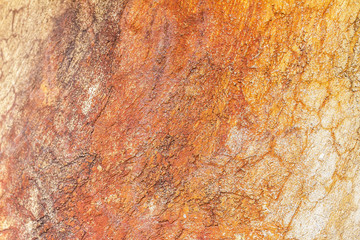 Abstract background texture cement wall in  orange yellow tone. Grunge wall texture. Cement texture and background with copy space for text or image. Center focus. Blurry edges.