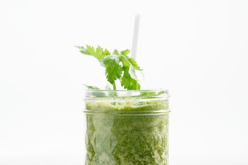 Fresh green juice smoothie made with organic green fruits and ve