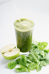 glass of fresh green spinach and kale healthy smoothie