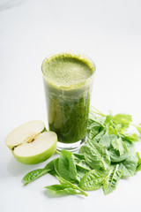 glass of fresh green spinach and kale healthy smoothie