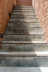 Concrete Staircase with brick wall