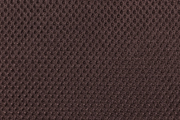 Abstract background texture of brown fishnet cloth material. Brown nylon texture for background and design with copy space for text or image.