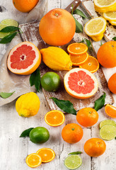 Citrus fruits on wooden table.