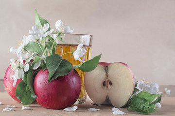 blank with glass of apple juice and apples with flowers