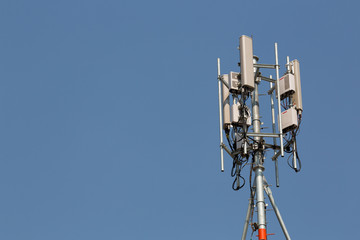 communication tower on blue sky background
