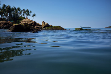 landscape of tropical beach with rocks