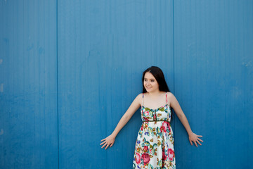 Teenage girl with a blue background