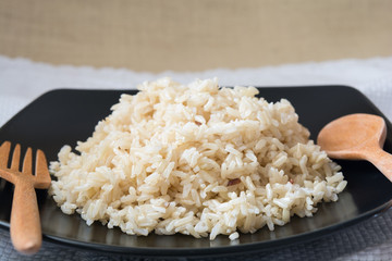 brown Rice on black plate 