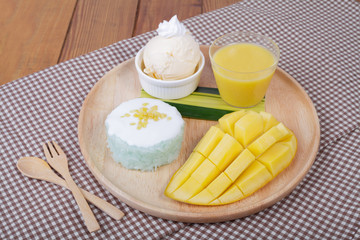 dessert sweet sticky rice with mango coconut milk and ice cream,