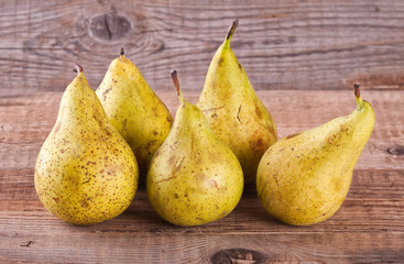 Pears on wooden table. 