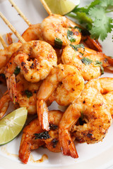 grilled shrimp kababs with sriracha and lime.