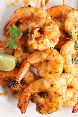 grilled shrimp kababs with sriracha and lime.