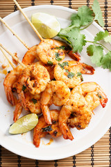 grilled shrimp kababs with sriracha and lime.
