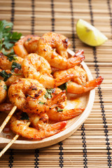 grilled shrimp kababs with sriracha and lime.