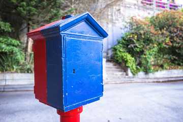 metal mailbox on road near house