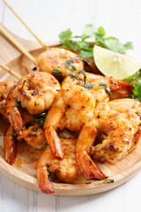grilled shrimp kababs with sriracha and lime.