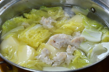 boiled Chinese cabbage with egg tofu and minced pork soup in hot pot