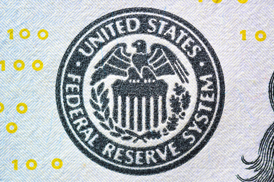 Close up of FEDERAL RESERVE SYSTEM seal on US dollar bill